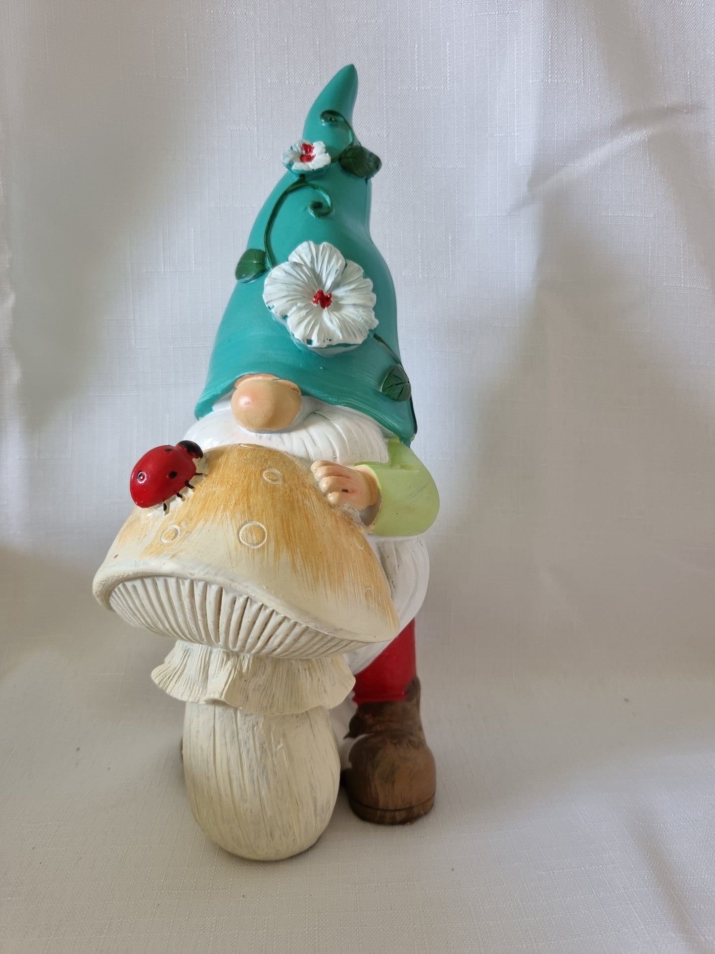 Garden Gnome Resting on Mushroom