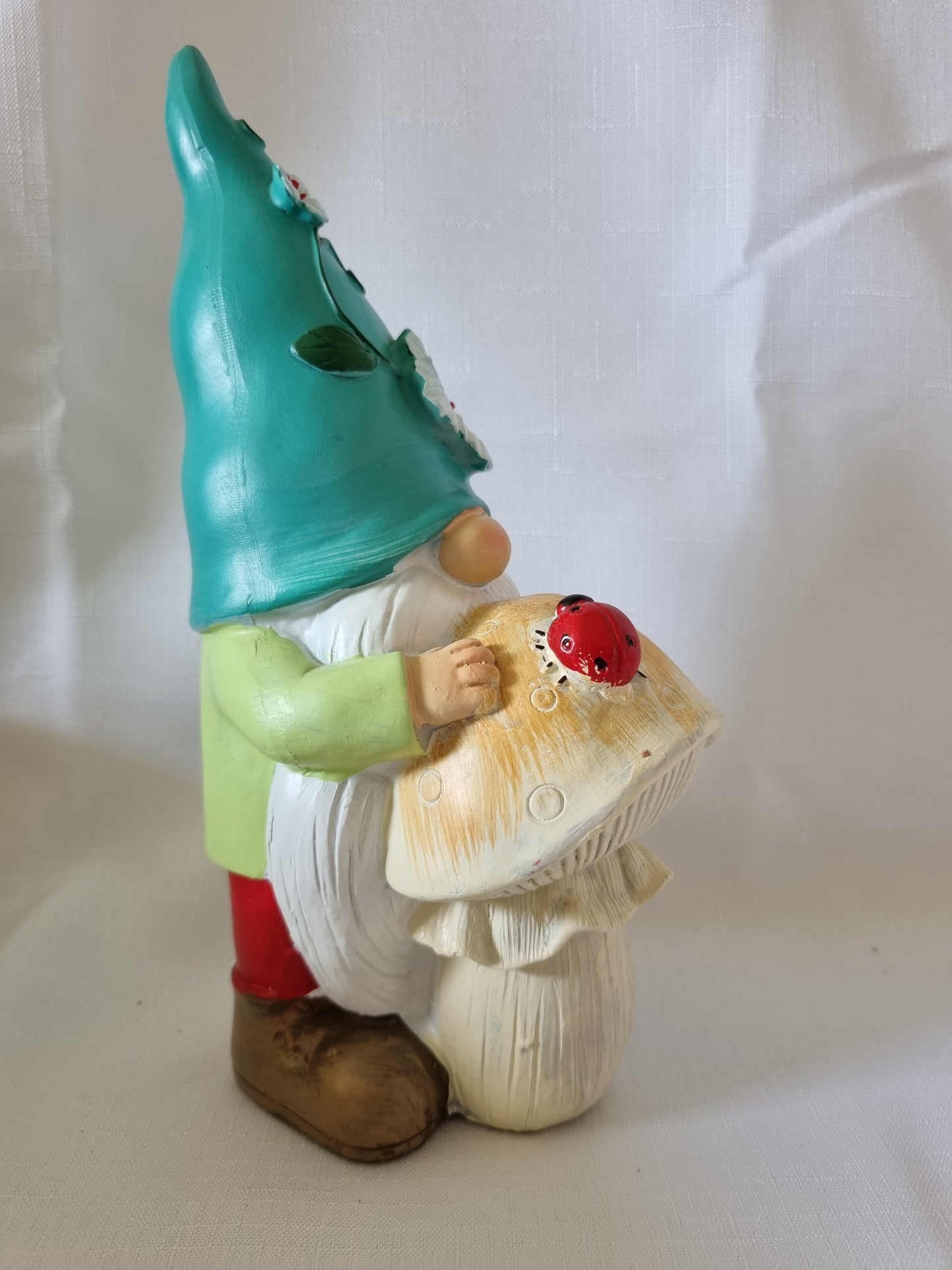 Garden Gnome Resting on Mushroom